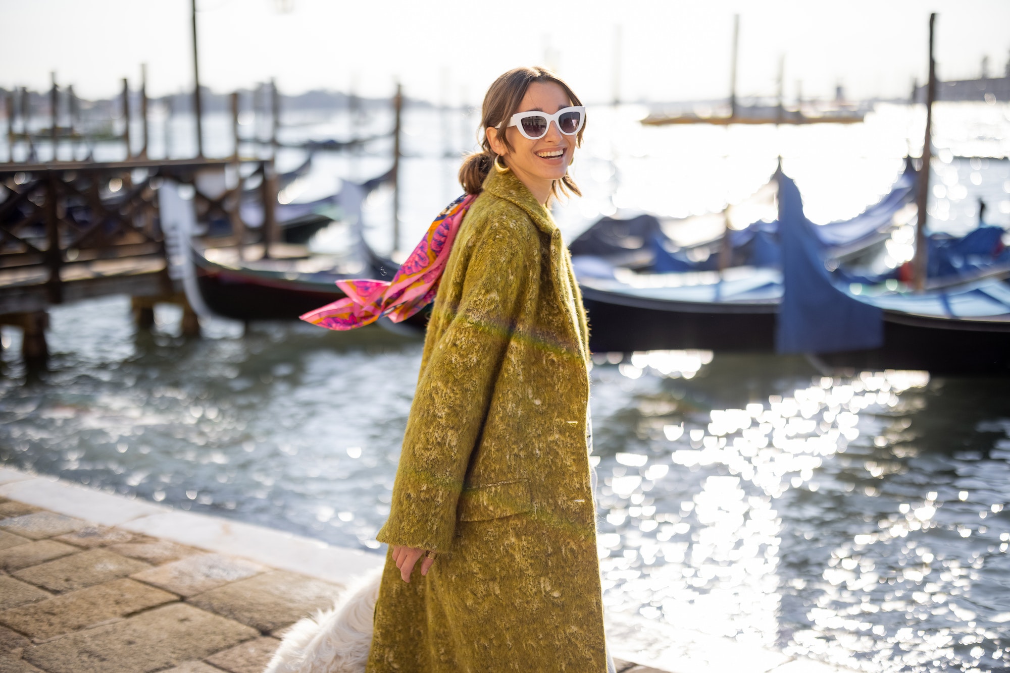 Stylish woman walking in Venice, Italy