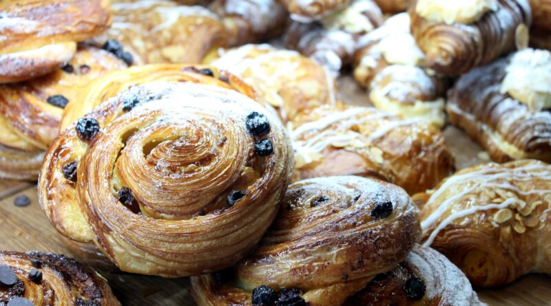 Tempting variety of gourmet danishes in the patisserie display cabinet