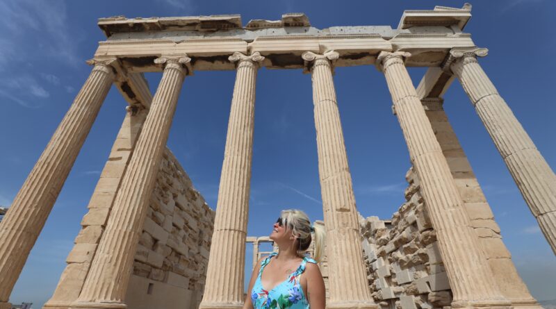 A blond woman wandering around Acropolis in Athens, Greece